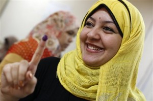 An Egyptian woman shows her inked finger after voting during the second day of presidential elections inside a polling station in the Mataraya neighborhood of Cairo, Egypt, Thursday, May 24, 2012. Egyptians voted Thursday on the second day of a landmark presidential election that will produce a successor to longtime authoritarian ruler Hosni Mubarak. (AP Photo/Fredrik Persson)